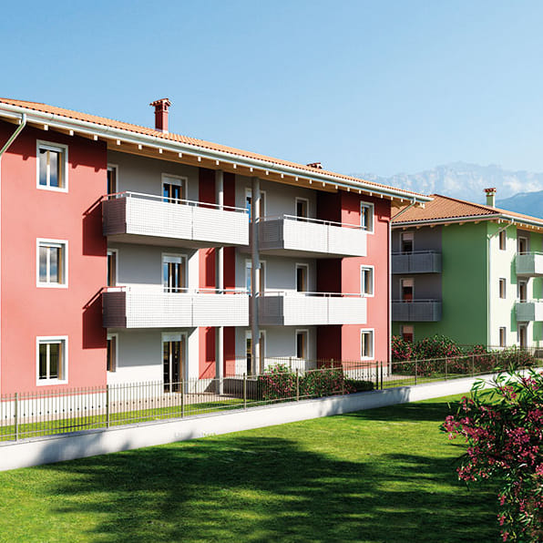 Render della Residenza Francesca a Rovereto: palazzine rossa e verde con balconi e prato