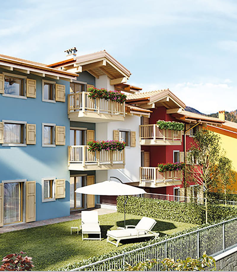 Render della Residenza Sabrina a Brentonico: edifici colorati con balconi fioriti e giardino