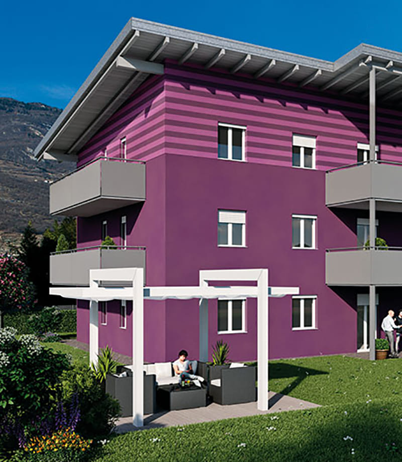 Render della Residenza Anna: edificio viola con balconi grigi, pergola e giardino